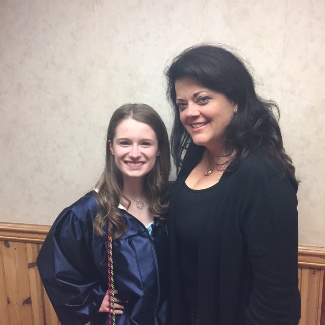 Penny McNicholas presented Katie Obrien the Tommy O Scholarship award at St. Dominic High School's graduation ceremony on June 6, 2015.